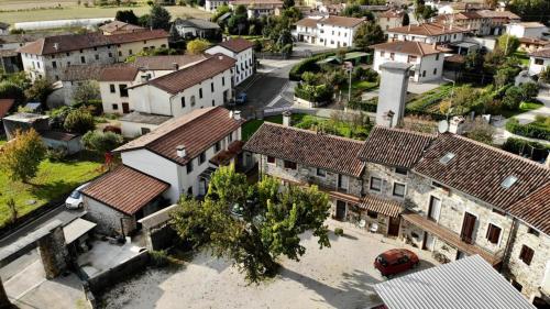 an aerial view of a town with white buildings at Agriturismo Clochiatti in Povoletto
