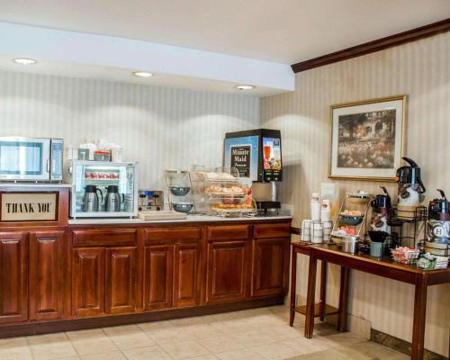 a kitchen with a counter with a coffee shop at Quality Inn in Rocky Mount