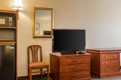 a flat screen tv sitting on a dresser in a room at Quality Inn Hackettstown - Long Valley in Hackettstown