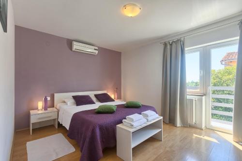 Postel nebo postele na pokoji v ubytování Villa Nina