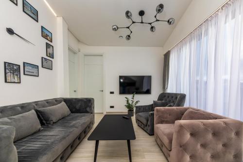 a living room with a couch and a table at M50 Apartments in Palanga
