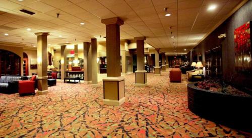 a lobby of a hotel with couches and chairs at Holiday Inn Dubuque/Galena by IHG in Dubuque