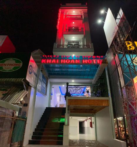 a view of a hotel at night with a red sign at Khải Hoàn Luxury Hotel in Bến Cát