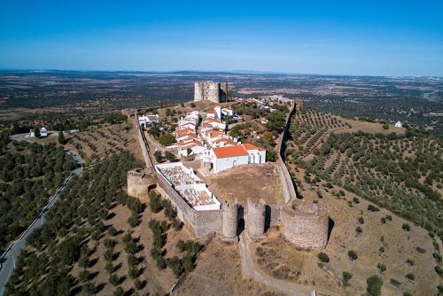 an aerial view of a castle on an island at The Place at Evoramonte in Évora Monte