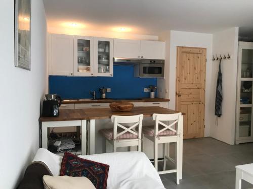 Kuchyň nebo kuchyňský kout v ubytování Chalet PapaGna Apartment