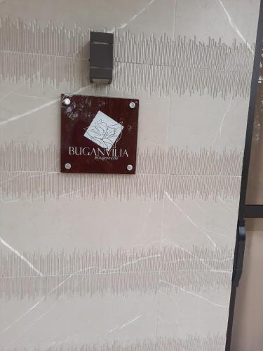 a metal bar on a wall with a blade at Capão do Cerrado Pousada e Spa in Itabirito