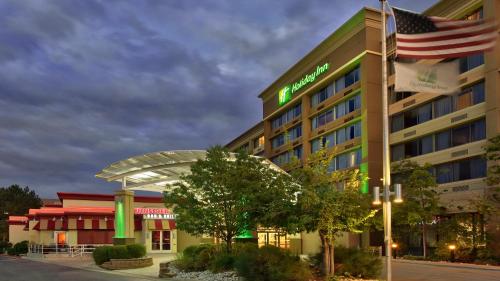 a hotel with an american flag on top of it at Holiday Inn Denver Lakewood by IHG in Lakewood