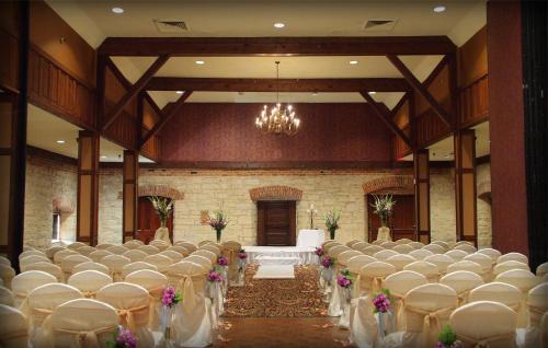a banquet hall with rows of tables and chairs at Holiday Inn At Six Flags Saint Louis by IHG in Eureka