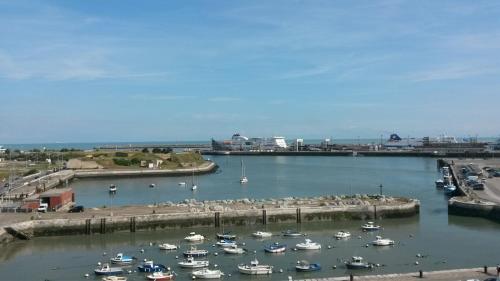 a group of boats are docked in a harbor at Holiday Inn Calais-Centre by IHG in Calais