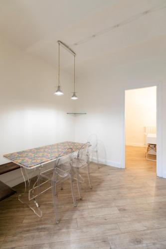 a dining room with a table and chairs at Saragozza Apartments - Bologna Short Rental in Bologna