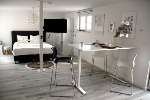 TV a/nebo společenská místnost v ubytování Appartement Blanc cocooning