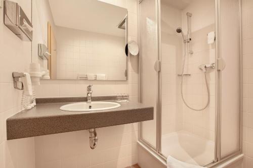 Ванна кімната в Hotel Leipzig-Günthersdorf