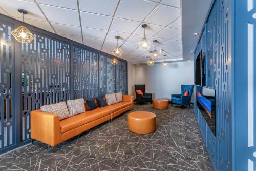 an office lobby with a couch and chairs at Comfort Inn in Sarnia
