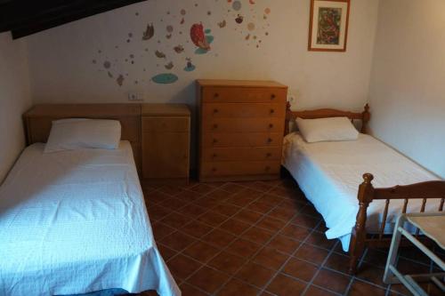 A bed or beds in a room at Ca na Mar: Charming House in the heart of Bunyola, Tramuntana