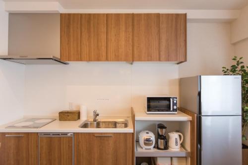 Virtuvė arba virtuvėlė apgyvendinimo įstaigoje R&Run Kyoto Serviced apartment & Suites - Vacation STAY 99370