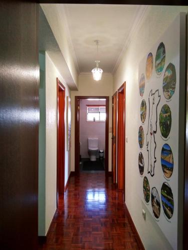 a hallway with plates on the walls of a building at O Terraço da Ribeira in Sertã