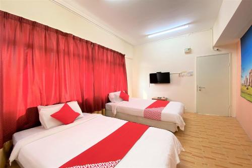Кровать или кровати в номере OYO 89540 B Hotel Penang