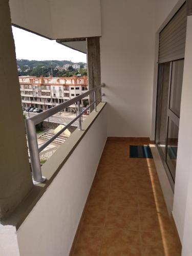 a room with a balcony with a view at O Terraço da Ribeira in Sertã