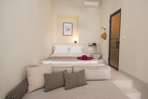 Postel nebo postele na pokoji v ubytování Pyli Apartments