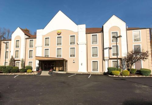 a large building with a parking lot in front of it at Comfort Inn Pittsburgh Crafton in Pittsburgh