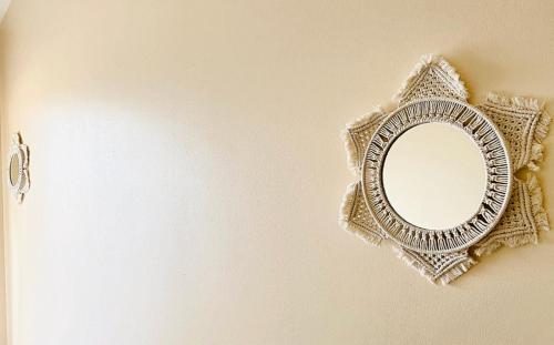 a mirror is hanging on a wall at Hamilton Cove-Boho Chic Villa w/Golf Cart...No pets. in Avalon