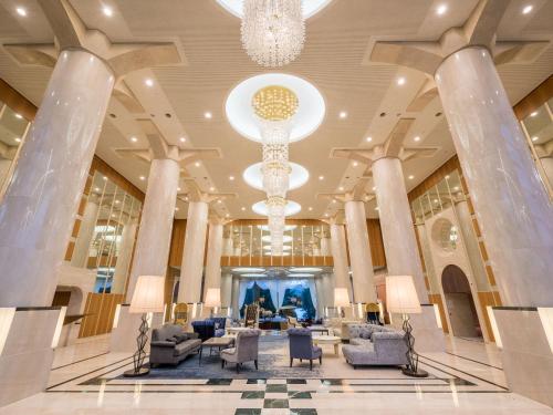 a lobby of a hotel with a chandelier at Urabandai Lake Resort Geihinkan Nekoma Rikyu in Kitashiobara