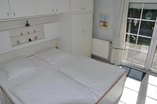 Un ou plusieurs lits dans un hébergement de l'établissement Friesenhaus-Maren-Strandflieder