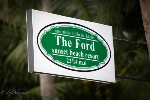 a sign for the ford sunset beach resort at The Ford SunSet Beach Resort in Wok Tum