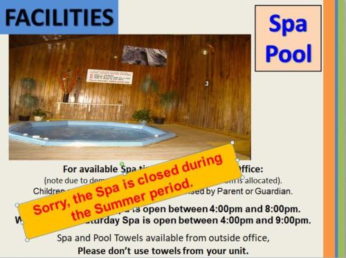 a flyer for a spa pool with a sign at Motel Sierra in Whangarei