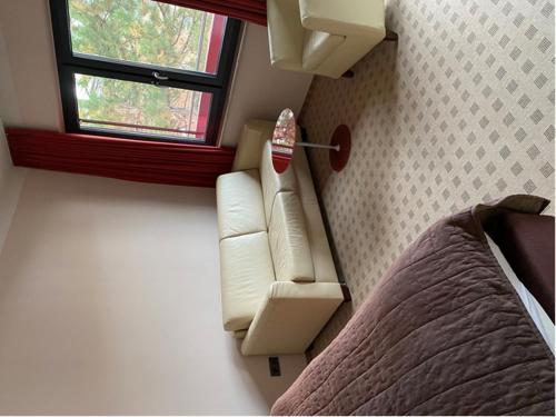 Postel nebo postele na pokoji v ubytování Wohnen mit Stil und Licht im Gästehaus ZWO