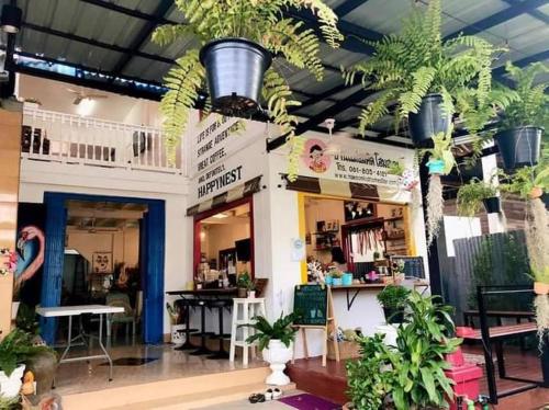 a shop with potted plants in the middle of a room at Baan Mae Somkid Homestay in Sukhothai