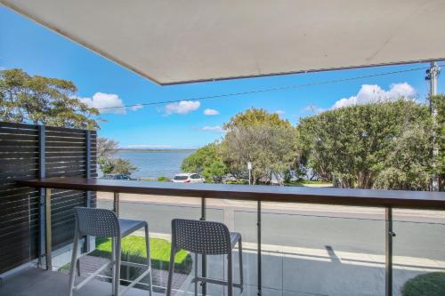 a view of the water from the balcony of a house at 5 Knots Metung in Metung