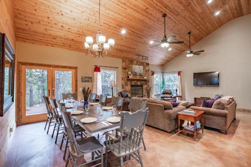 a living room with a table and chairs and a couch at Mountain Retreat with Hot Tub & Pool Table - 1 hour from Squaw Valley Resort! in Colfax
