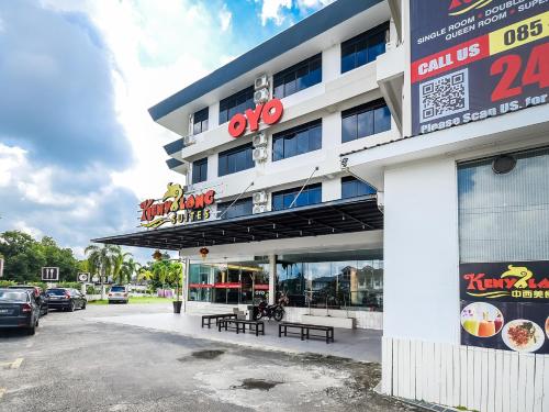 a building with a parking lot in front of it at Kenyalang Suite in Miri