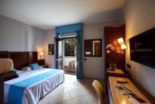 Letto o letti in una camera di Hotel Le Palme