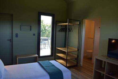 En eller flere senger på et rom på Gîte Nuvole