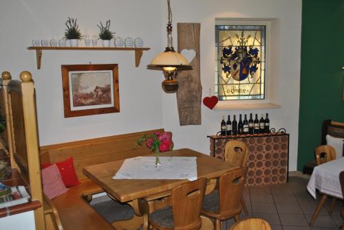 a dining room with a table with chairs and a window at Landgasthof Gietl in Kammern im Liesingtal