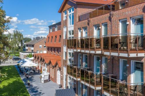an aerial view of a building with balconies at WH Hotels Papenburg Zentrum in Papenburg