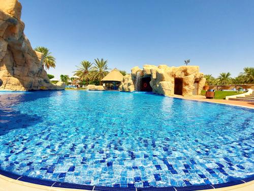 a large swimming pool in a resort at Danat Al Ain Resort in Al Ain