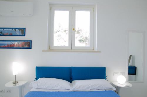Letto o letti in una camera di Villa Idris