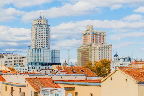 a view of a city with tall buildings at Hotel Opera in Madrid