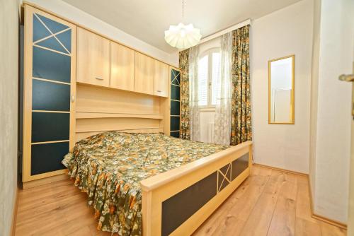 Postel nebo postele na pokoji v ubytování Apartments Udovicic HH