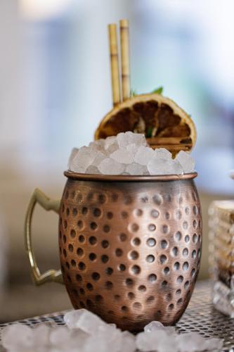 a metal cup filled with ice on a table at Jo An Palace in Rethymno Town