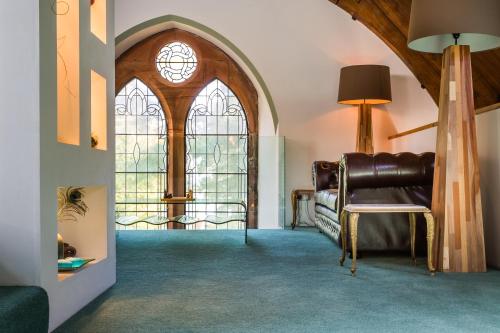 a bedroom with a bed and a large window at Eastkirk in Corrie