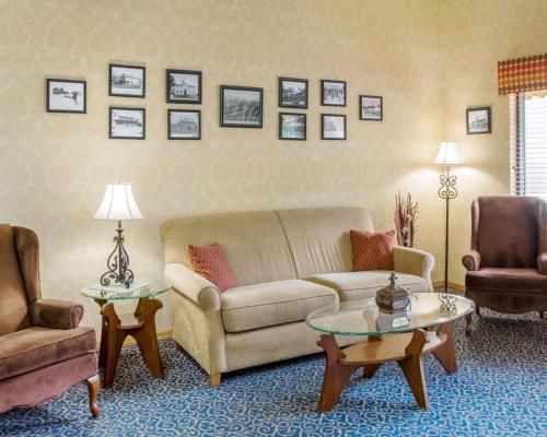 a living room with a couch and two chairs at Comfort Inn in Piketon