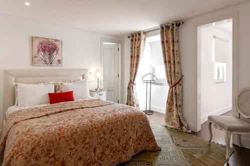 מיטה או מיטות בחדר ב-Lisbon Rentals Chiado