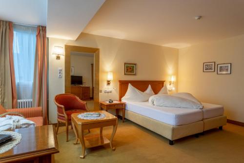 Postel nebo postele na pokoji v ubytování Hotel Bemelmans-Post