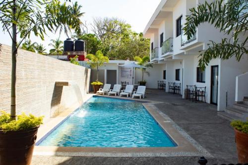 Πισίνα στο ή κοντά στο Suites del Carmen