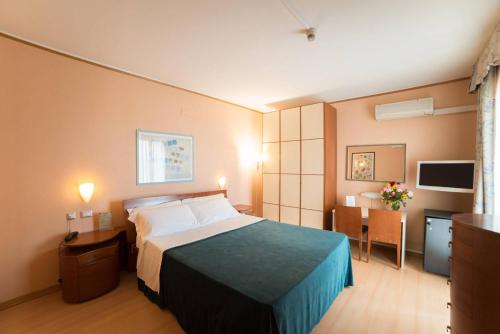 Postel nebo postele na pokoji v ubytování Montebello Park Hotel