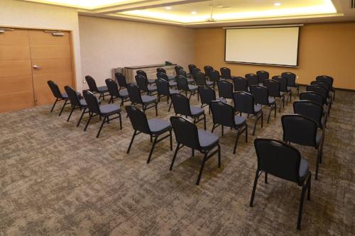 a room with a bunch of chairs and a whiteboard at Holiday Inn - Ciudad Juarez by IHG in Ciudad Juárez